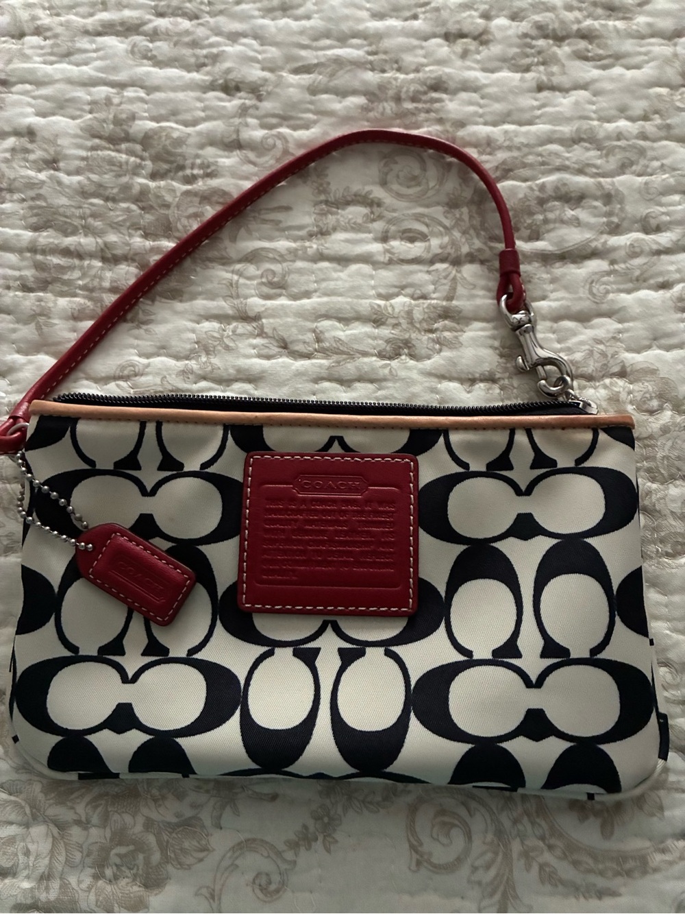 New without tags - Coach Signature Canvas Wristlet in Black, White and Red
